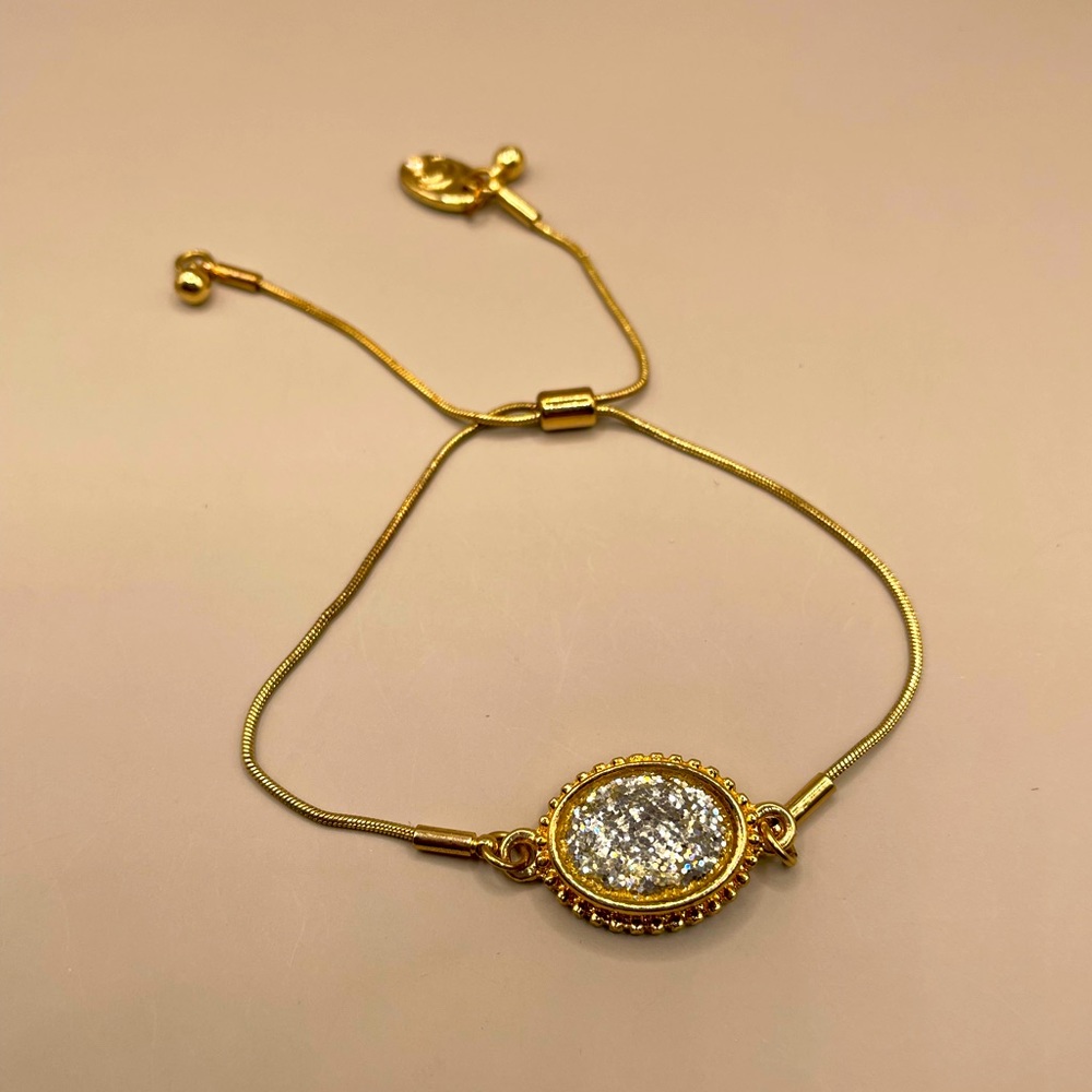 Charming Charlie adjustable bracelet with oval glitter crystal stone signet
